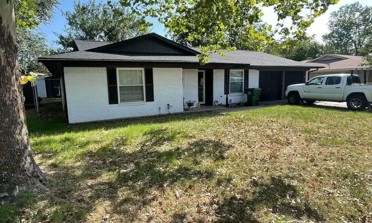 Professional roofing crew working on a residential roof in Shamong